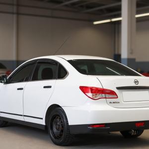 Ниссан Альмера после замены стеклоподъемника в автотехцентре